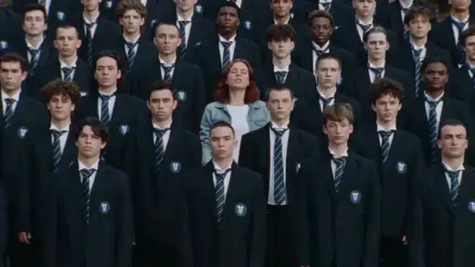 The peak of the Storm trend: the crowd of students bows, then throws their heads back, while the lead in a denim jacket stands still in the middle