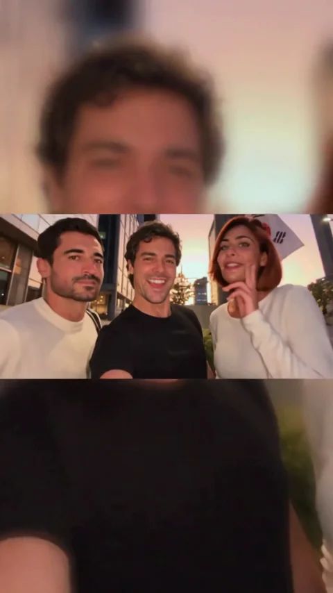 Two men and one woman in the night-street trio selfie